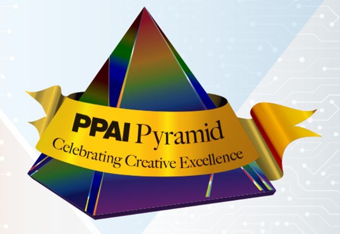 In early 2019 we decided to enter the 2020 Promotional Product Association International Pyramid Contest.  The Pyramid Award is the highest award given in the marketing and advertising industry for the creatively effective and financially efficient use of promotional products and other platforms of advertising.  There are over 15,000 businesses like ours in the PPAI organization, but our attitude was, “If we don’t enter, we can’t win.”  So – we started filling out the mountains of paperwork needed to enter.  Our entry was The Crazy Sister Cafe, a business formerly located in Annapolis, MO, in regards to the advertising and social media work we did for the cafe.  The contest period was April 2018 to March 2019.  Our entry was due in May 2019.  We entered, then we waited, as the entries are judged over the summer.