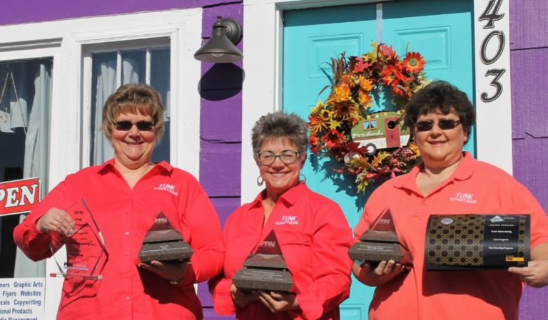 Here we are at our office location, Purple House Business Complex, holding our previous Pyramids.  We're getting ready to add another one to our shelf!  Funk Advertising is one of the few independent agencies to win five Pyramid Awards.